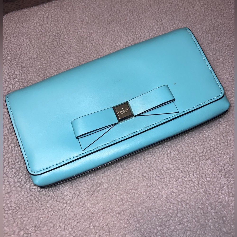 Kate Sade magnetic clutch closure in Tiffany Blue